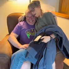 Kayti and Andy sittin' in a chair